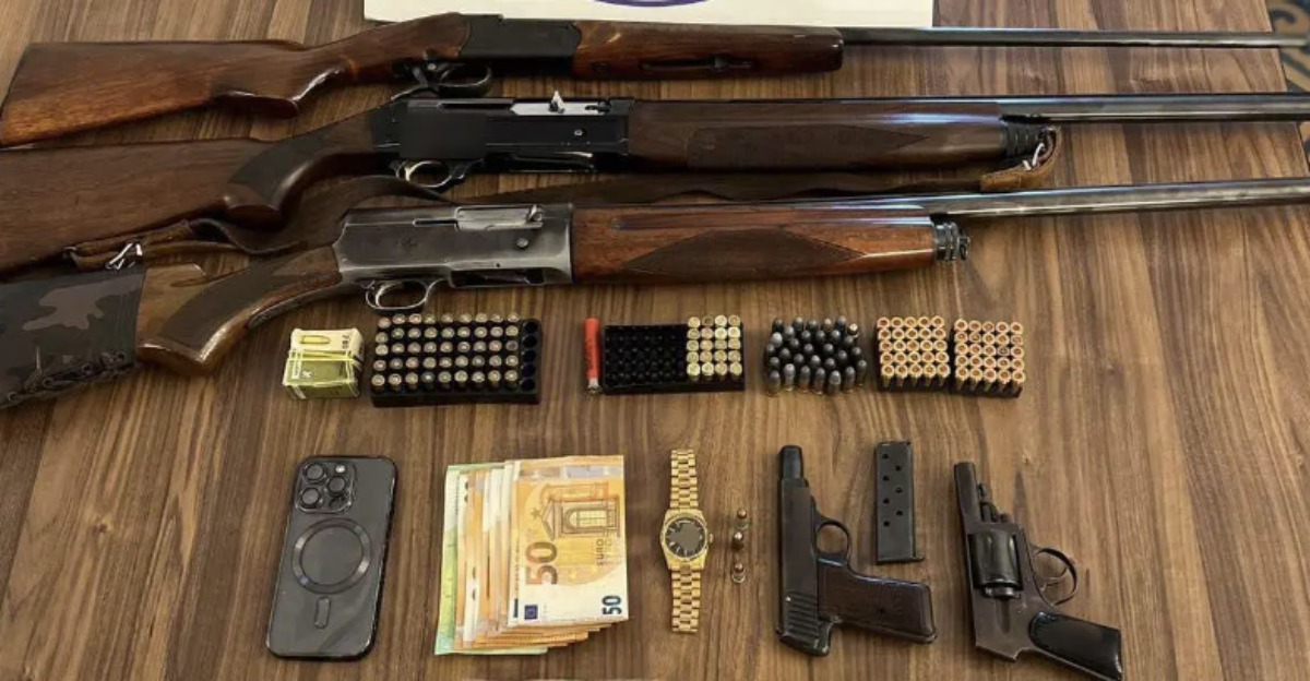 Police officer arrested for fraud and weapons
 –